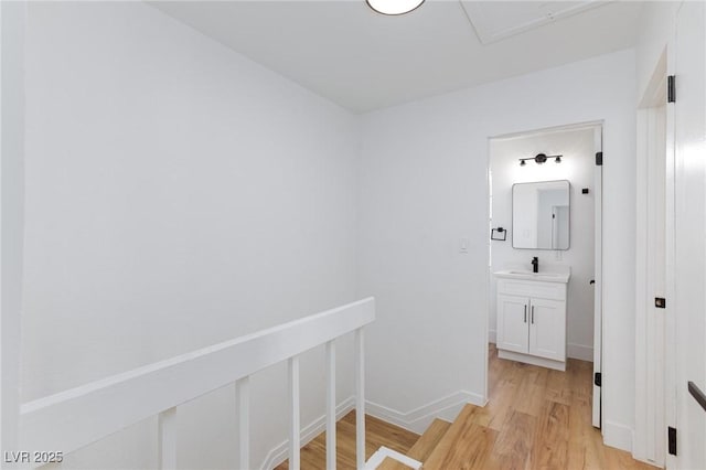 572 Tam O Shanter, Las Vegas, NV 89109 - hallway with light wood finished floors, an upstairs landing, and electric panel