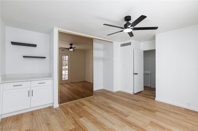 572 Tam O Shanter, Las Vegas, NV 89109 - unfurnished living room featuring a ceiling fan and light wood-style floors