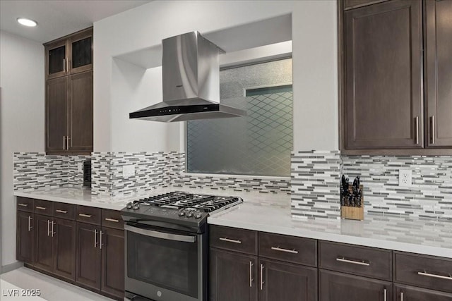 6618 Tangled Vines Ave, Las Vegas, NV 89139 - kitchen with gas stove, island exhaust hood, and dark brown cabinets