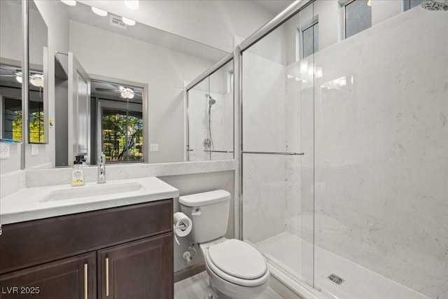 6618 Tangled Vines Ave, Las Vegas, NV 89139 - bathroom with vanity, a shower stall, and a ceiling fan