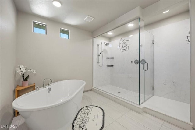 6618 Tangled Vines Ave, Las Vegas, NV 89139 - bathroom with a freestanding tub, a shower stall, recessed lighting, and tile patterned flooring