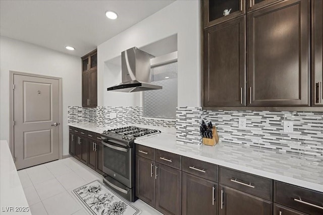 6618 Tangled Vines Ave, Las Vegas, NV 89139 - kitchen featuring range with gas stovetop, ventilation hood, dark brown cabinets, light countertops, and recessed lighting