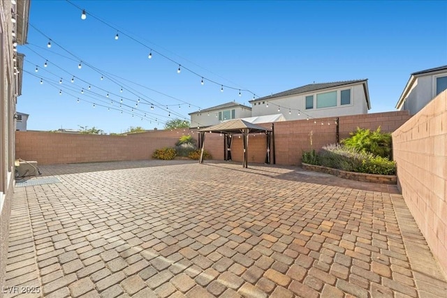 6618 Tangled Vines Ave, Las Vegas, NV 89139 - fenced backyard with a gazebo and a patio