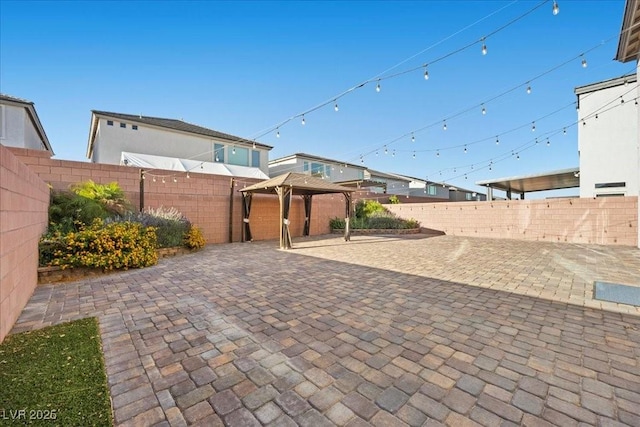 6618 Tangled Vines Ave, Las Vegas, NV 89139 - fenced backyard with a gazebo and a patio area