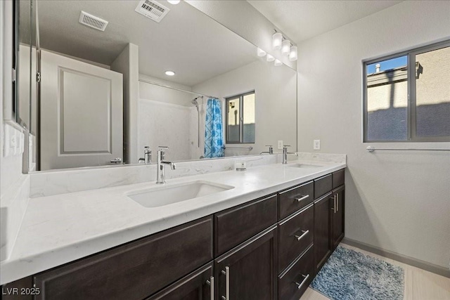 6618 Tangled Vines Ave, Las Vegas, NV 89139 - full bath featuring double vanity and curtained shower
