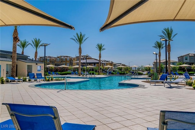 6953 Midnight Bronze St, North Las Vegas, NV 89086 - community pool featuring a patio and a residential view