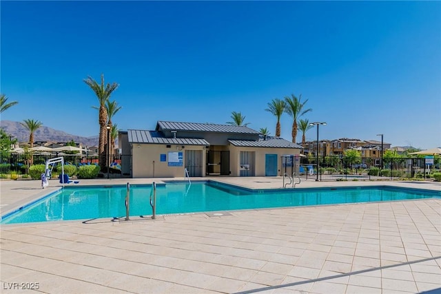 6953 Midnight Bronze St, North Las Vegas, NV 89086 - community pool with a mountain view, a patio area, and a residential view