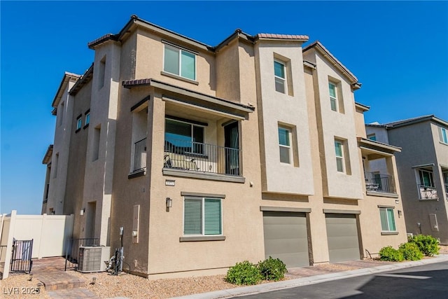 6953 Midnight Bronze St, North Las Vegas, NV 89086 - view of building exterior with an attached garage