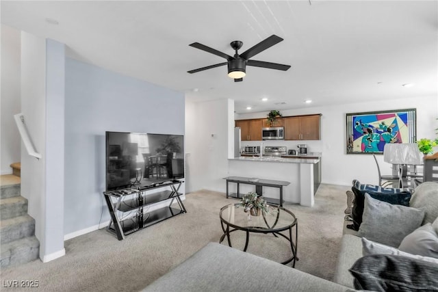 6953 Midnight Bronze St, North Las Vegas, NV 89086 - living room featuring stairs, light carpet, a ceiling fan, and recessed lighting
