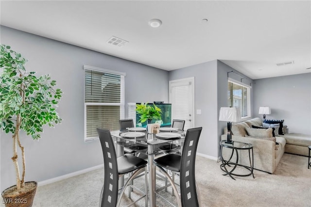 6953 Midnight Bronze St, North Las Vegas, NV 89086 - dining space featuring light colored carpet and baseboards