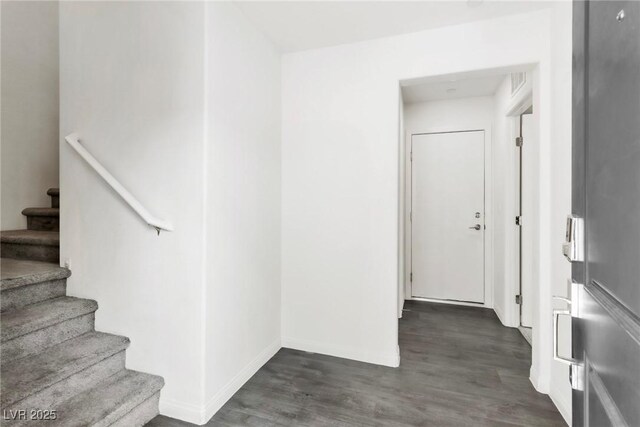 6953 Midnight Bronze St, North Las Vegas, NV 89086 - entrance foyer with dark wood-type flooring and stairs