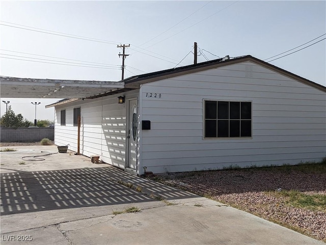 1220 Toledo St, Henderson, NV 89015 - view of side of home featuring a patio area