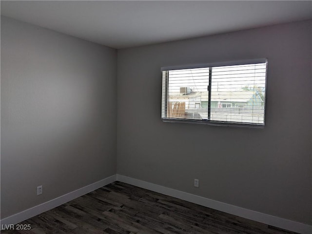 1220 Toledo St, Henderson, NV 89015 - empty room with dark wood finished floors and baseboards
