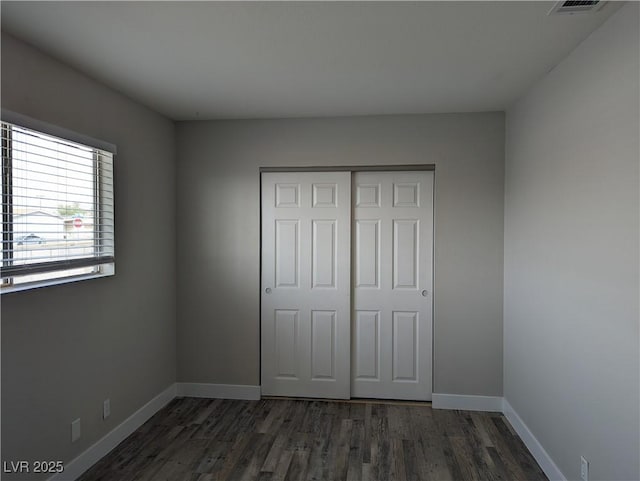 1220 Toledo St, Henderson, NV 89015 - unfurnished bedroom featuring wood finished floors and a closet