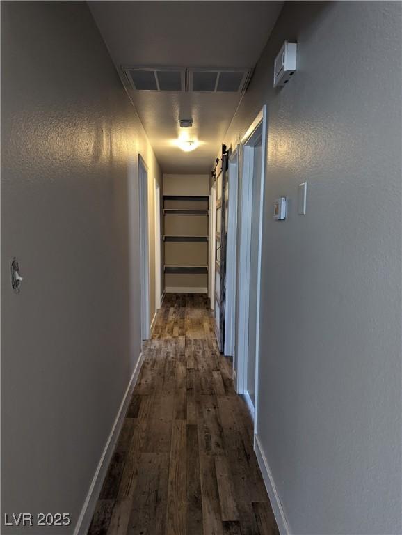 1220 Toledo St, Henderson, NV 89015 - hallway with dark wood-type flooring and baseboards