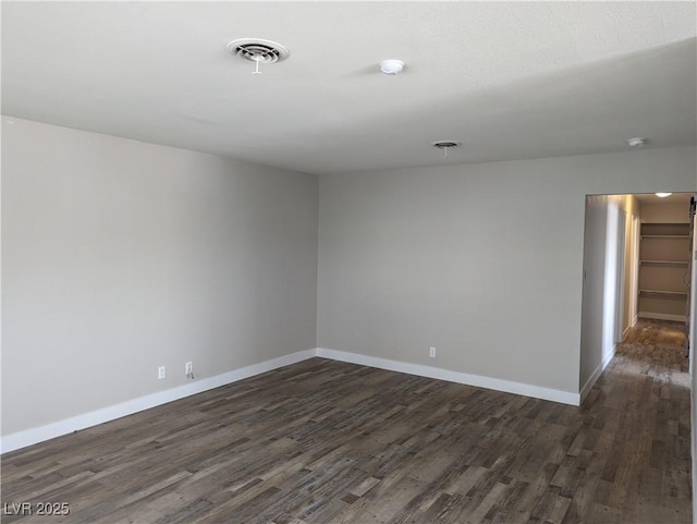 1220 Toledo St, Henderson, NV 89015 - unfurnished room with dark wood finished floors and a smoke detector