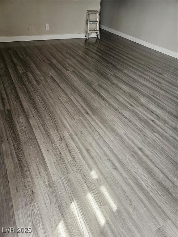 1220 Toledo St, Henderson, NV 89015 - empty room with dark wood-style floors and baseboards