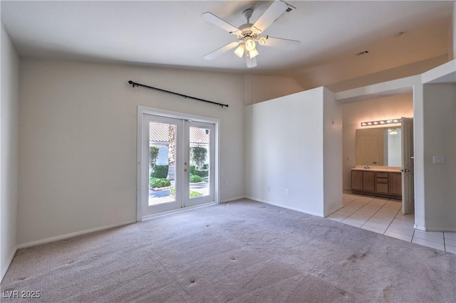 5425 Thomaston Ct, Las Vegas, NV 89122 - unfurnished bedroom with light carpet, lofted ceiling, light tile patterned floors, french doors, and access to outside