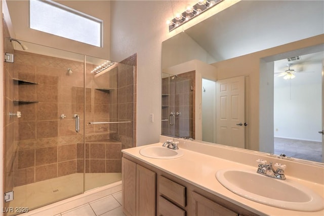 5425 Thomaston Ct, Las Vegas, NV 89122 - bathroom with a stall shower, double vanity, a ceiling fan, and tile patterned flooring