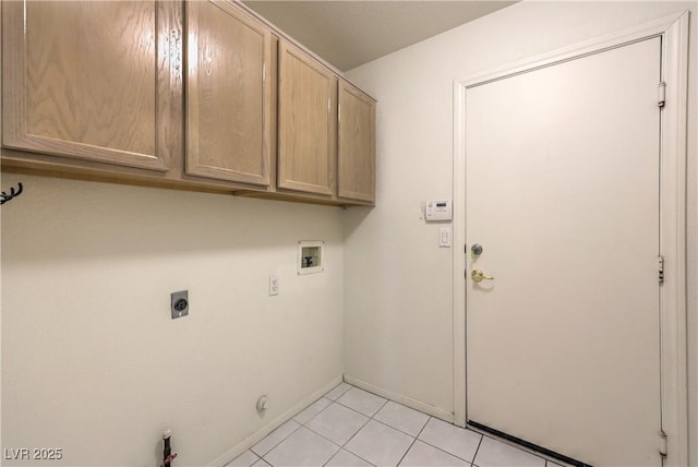 5425 Thomaston Ct, Las Vegas, NV 89122 - laundry area with cabinet space, hookup for a washing machine, hookup for an electric dryer, hookup for a gas dryer, and light tile patterned flooring