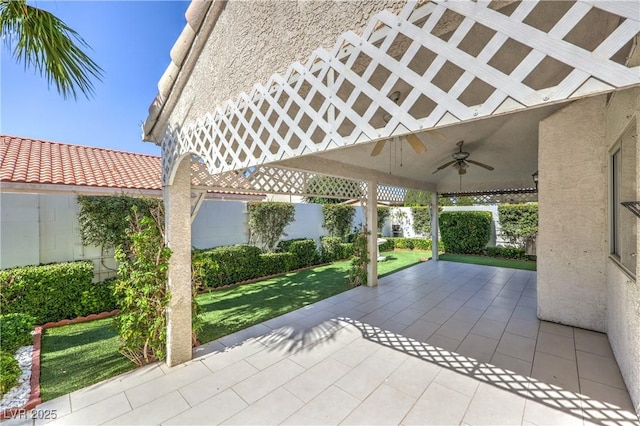 5425 Thomaston Ct, Las Vegas, NV 89122 - fenced backyard with a ceiling fan and a patio area