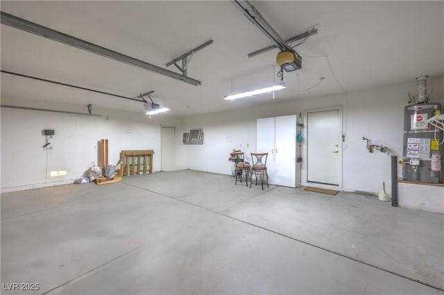 5425 Thomaston Ct, Las Vegas, NV 89122 - garage with strapped water heater and a garage door opener