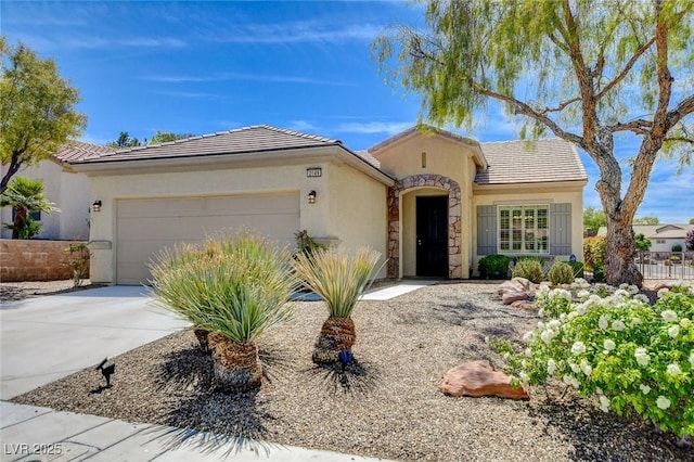 2149 Kelsey Creek Ct, Henderson, NV 89044 - mediterranean / spanish house with an attached garage, stucco siding, driveway, and a tiled roof