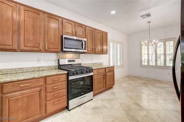 2149 Kelsey Creek Ct, Henderson, NV 89044 - kitchen with stainless steel appliances, a chandelier, light stone counters, brown cabinets, and recessed lighting