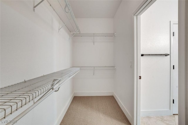 2149 Kelsey Creek Ct, Henderson, NV 89044 - walk in closet featuring light carpet
