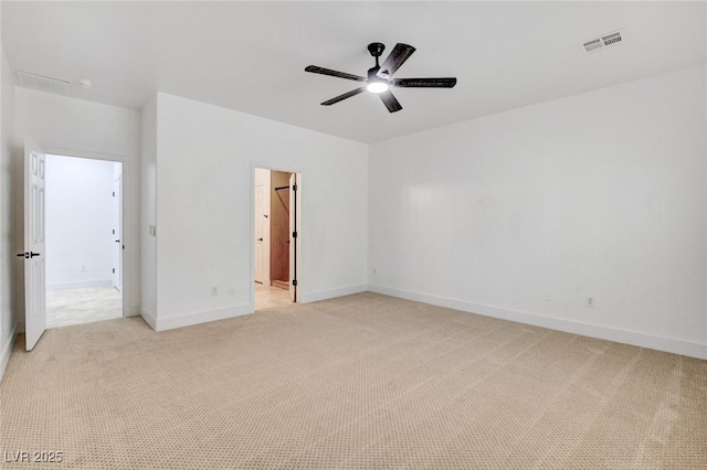 2149 Kelsey Creek Ct, Henderson, NV 89044 - unfurnished bedroom featuring light colored carpet, connected bathroom, and a ceiling fan