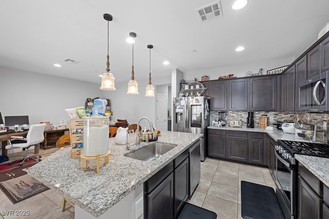145 Langley Hill Ave, Henderson, NV 89002 - kitchen with appliances with stainless steel finishes, tasteful backsplash, a desk, light stone counters, and light tile patterned flooring
