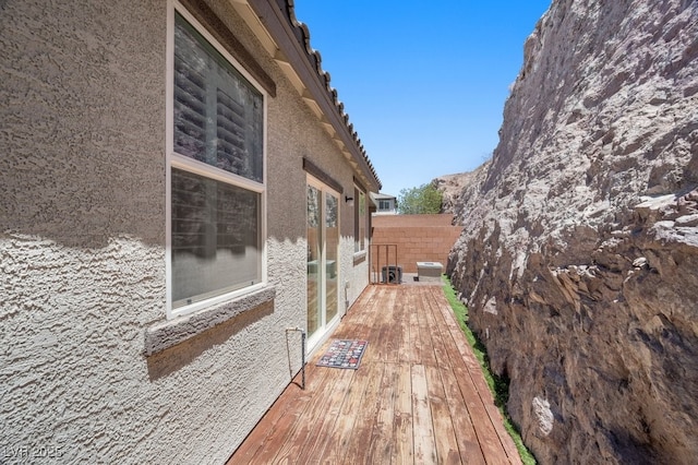 145 Langley Hill Ave, Henderson, NV 89002 - view of side of home featuring stucco siding and a deck