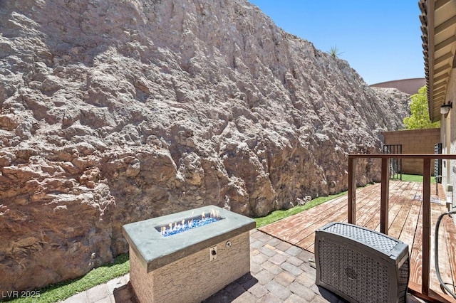 145 Langley Hill Ave, Henderson, NV 89002 - view of patio with a fire pit and a deck with mountain view