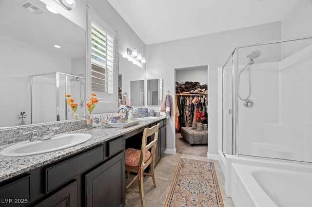 145 Langley Hill Ave, Henderson, NV 89002 - bathroom featuring a stall shower, double vanity, a walk in closet, and a bath