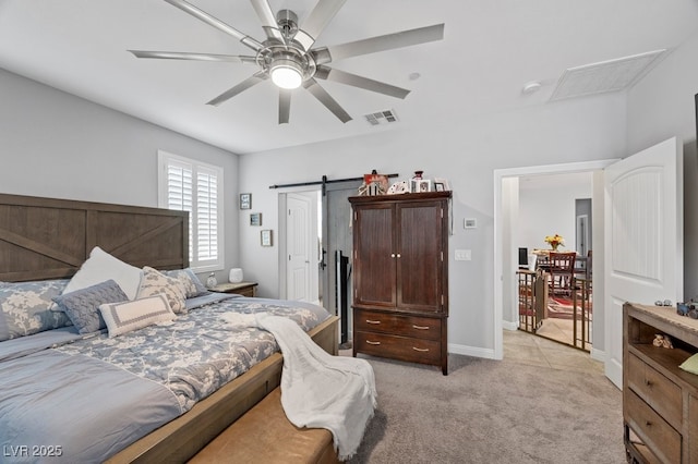 145 Langley Hill Ave, Henderson, NV 89002 - bedroom featuring light colored carpet, a barn door, and ceiling fan