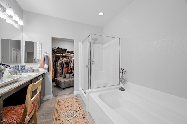 145 Langley Hill Ave, Henderson, NV 89002 - full bathroom featuring a stall shower, vanity, a bath, and a spacious closet