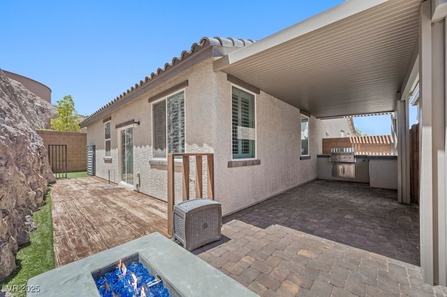 145 Langley Hill Ave, Henderson, NV 89002 - view of patio featuring exterior kitchen and a fire pit