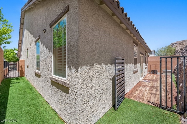 145 Langley Hill Ave, Henderson, NV 89002 - view of side of home with stucco siding and a tiled roof