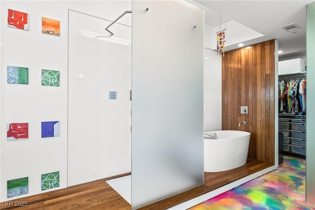 200 Hoover Ave Unit 1813, Las Vegas, NV 89101 - bathroom with a soaking tub, a walk in closet, and recessed lighting