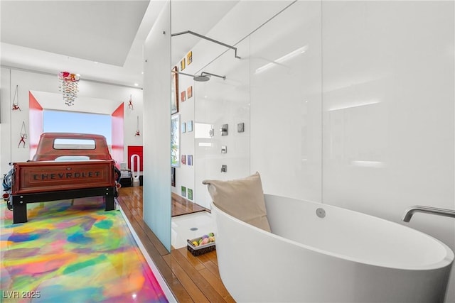200 Hoover Ave Unit 1813, Las Vegas, NV 89101 - bathroom with wood-type flooring, a freestanding tub, and a walk in shower