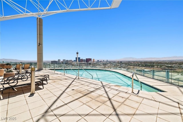 200 Hoover Ave Unit 1813, Las Vegas, NV 89101 - community pool with a mountain view, a city view, and a patio