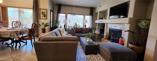 7395 Howell Mill Ct, Las Vegas, NV 89113 - living room featuring light tile patterned floors and a high end fireplace