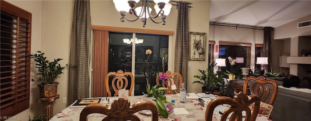 7395 Howell Mill Ct, Las Vegas, NV 89113 - dining area with a chandelier