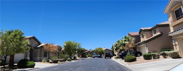 7395 Howell Mill Ct, Las Vegas, NV 89113 - view of asphalt street featuring a residential view and curbs