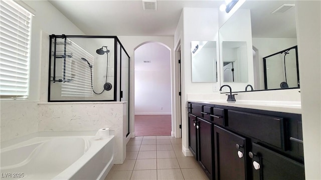 145 Forest Crossing Ct, Las Vegas, NV 89148 - full bath featuring a stall shower, a bath, vanity, and tile patterned floors