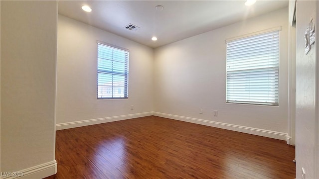 145 Forest Crossing Ct, Las Vegas, NV 89148 - empty room with dark wood-style flooring and recessed lighting