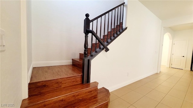 145 Forest Crossing Ct, Las Vegas, NV 89148 - stairs featuring arched walkways and tile patterned flooring