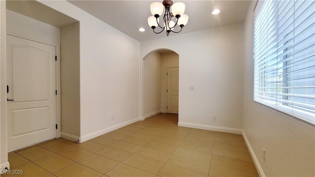 145 Forest Crossing Ct, Las Vegas, NV 89148 - spare room with arched walkways, a chandelier, light tile patterned floors, and recessed lighting