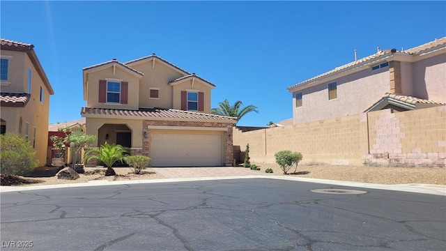 145 Forest Crossing Ct, Las Vegas, NV 89148 - mediterranean / spanish-style home with driveway, stucco siding, and a tiled roof