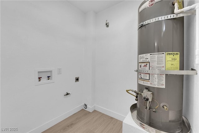 1108 Putnam Ave, North Las Vegas, NV 89030 - laundry room with secured water heater, electric dryer hookup, hookup for a washing machine, and wood finished floors